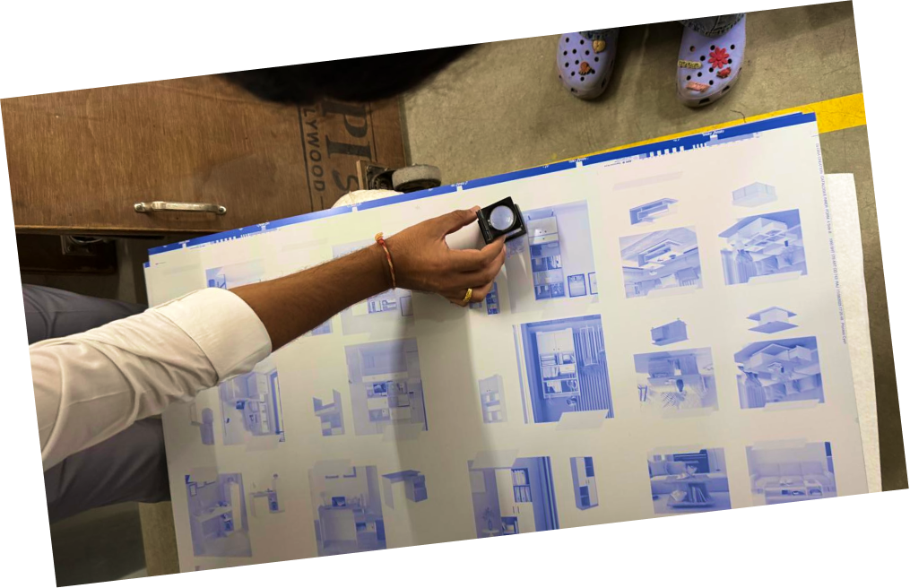 Interior design blueprints being reviewed with a loupe