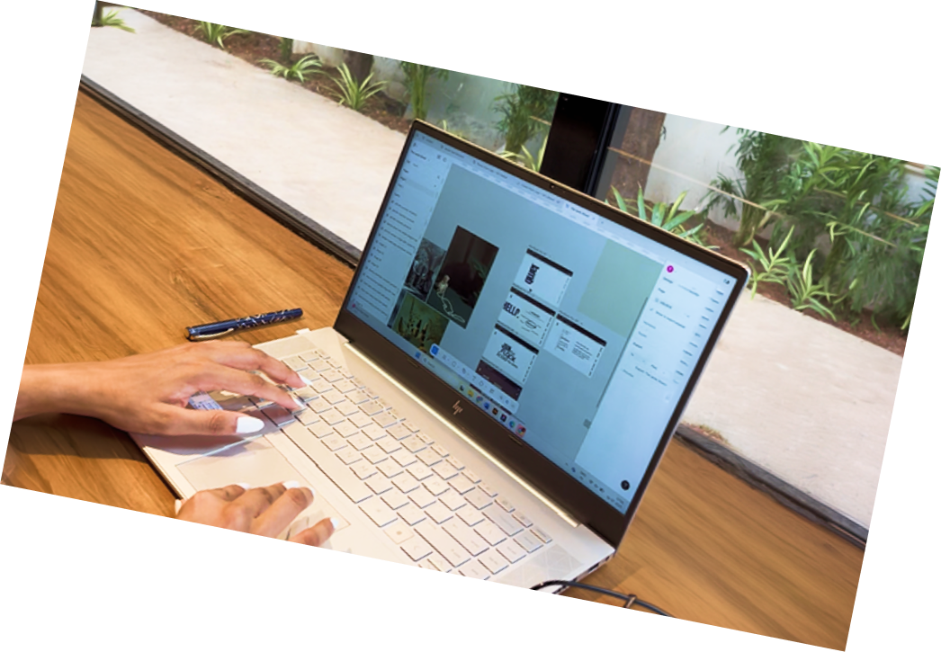 Designer working on brand layouts on a laptop